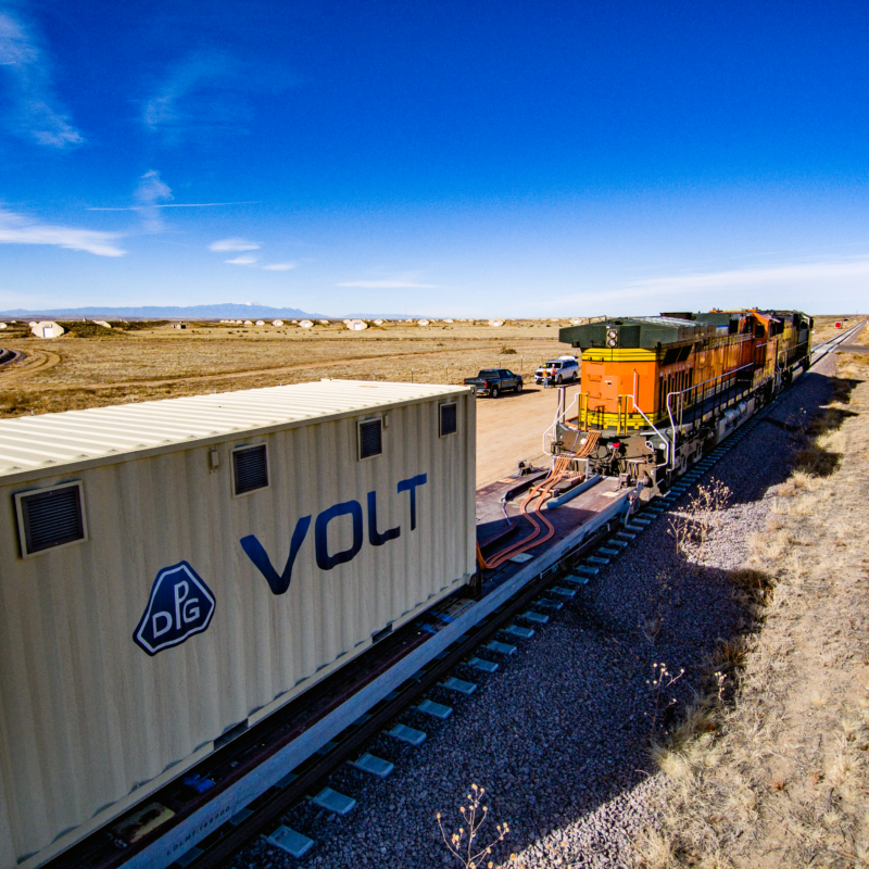 VOLT battery unit connected to locomotive during real-world rail testing on open track